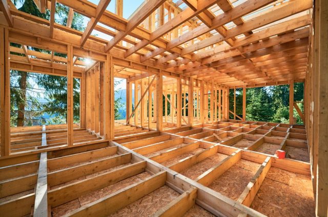 Under-construction,Residential,Wooden,Frame,Home,Located,Near,A,Forest.,Commencement